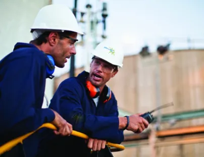 Two men in hard hats talking to each other (1)