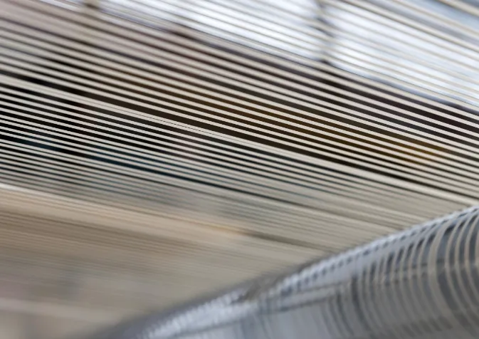 A close up of a machine that is weaving