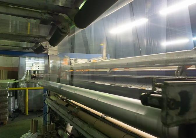 A machine is making a piece of fabric