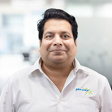 Headshot of Mandar Dharmadhikari.