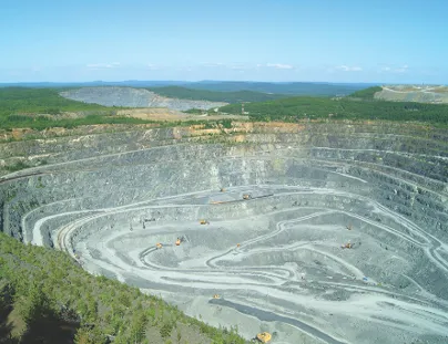 An open pit mine with a large pit in the middle