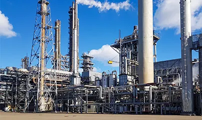 A large industrial refinery with pipes and stacks