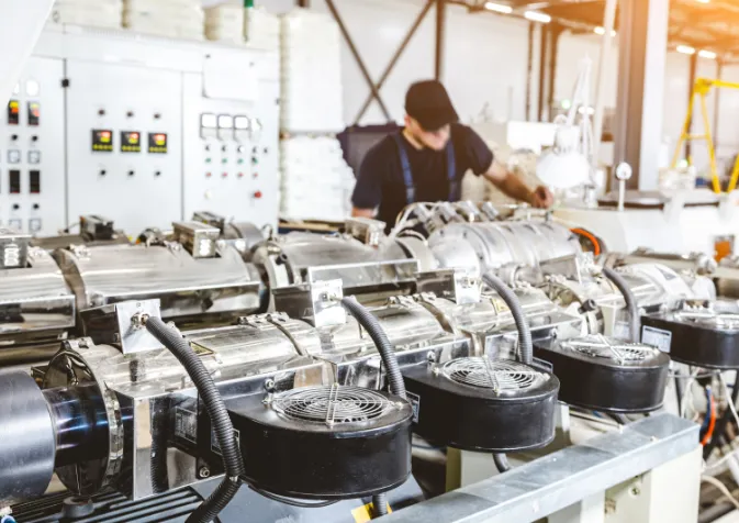 A man working on a machine in a factory