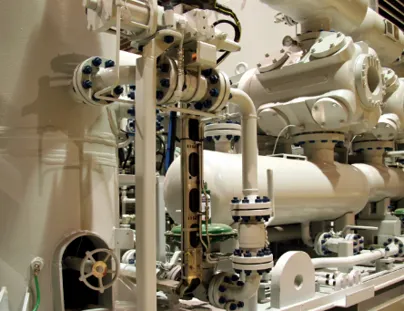 A large white machine with pipes and valves