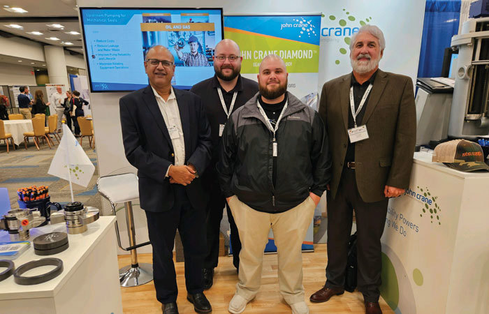 John Crane staff in front of TAPPI PEERS Booth