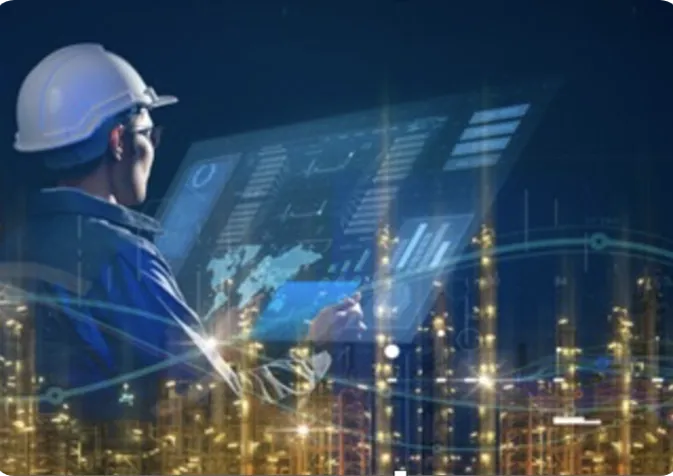 Worker with hard hat looking at screen overlayed with industrial plant in the background