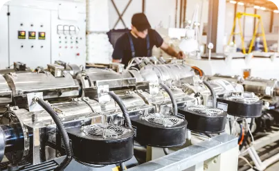 A man working on a machine in a factory